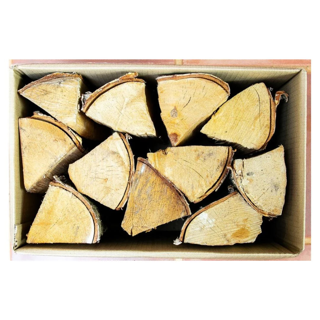Wooden logs arranged in a box on a white background